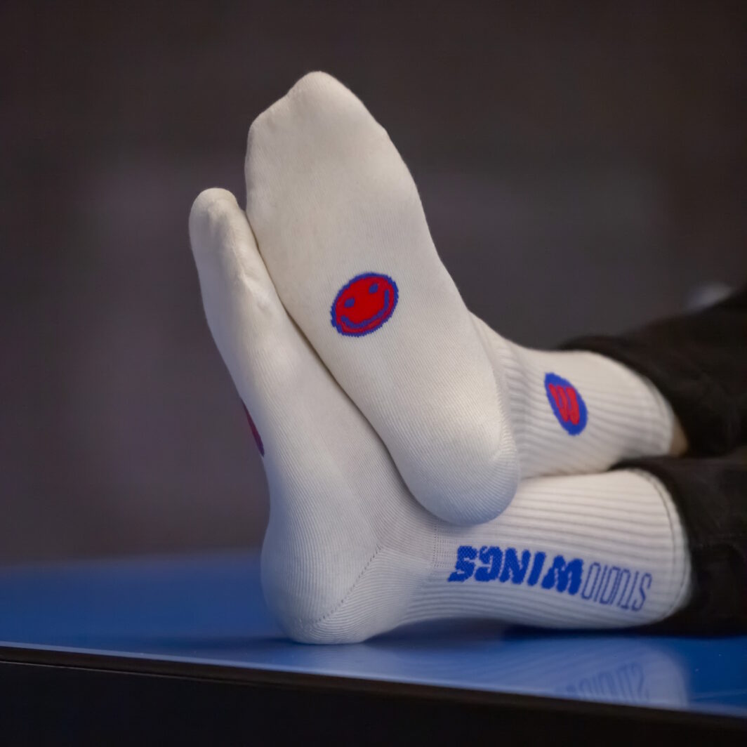 Socken Smiley Fußsohle Schriftzug